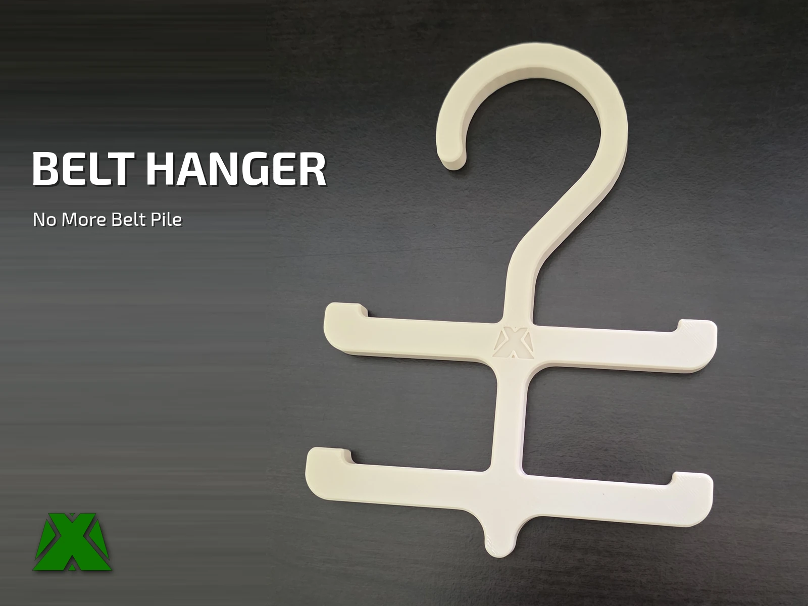 The finished belt hanger printed in cream PLA, showing the hook, both belt bars and the embossed MakerX X