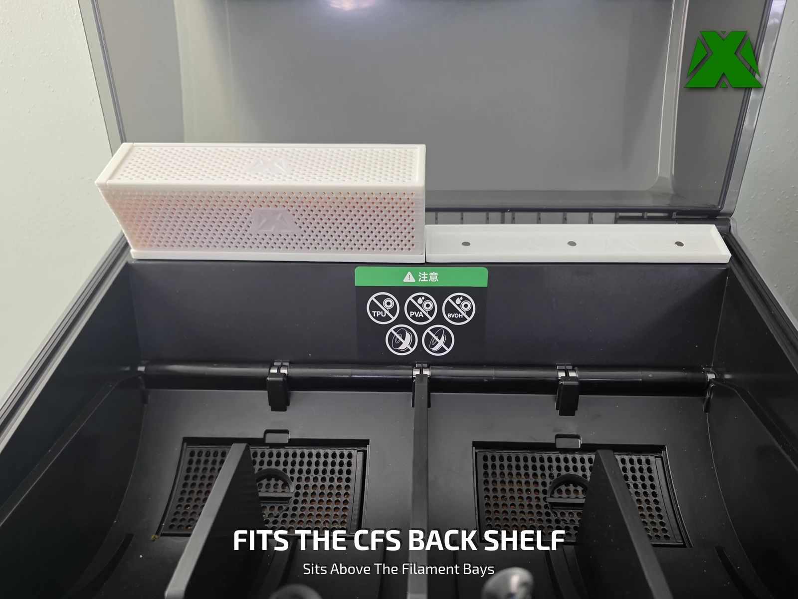 A tray seated on the back shelf of an open Creality CFS, above the filament bays