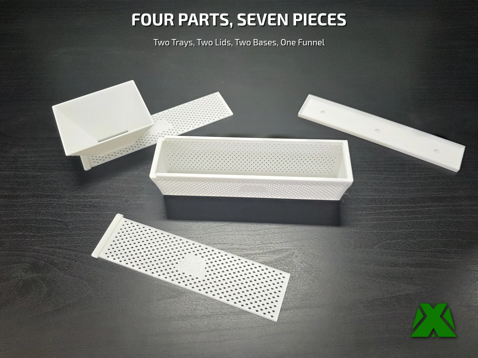 The printed parts laid out: two trays, two lids, two bases and a funnel