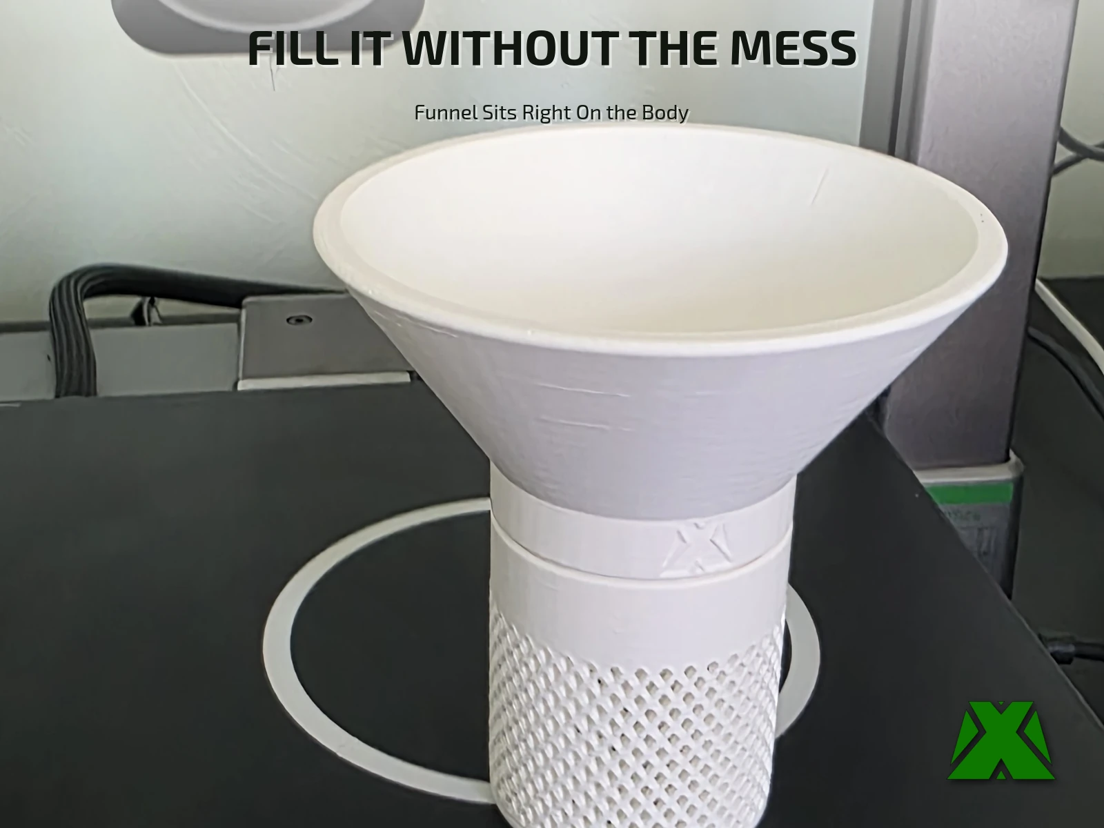 The funnel seated on top of the container body, its threaded collar carrying the embossed MakerX mark