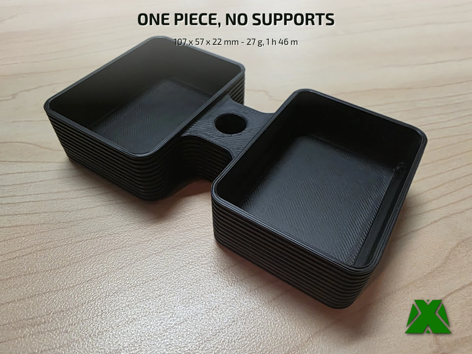 The printed holder alone on a maple desk, both sauce bays empty and the round straw port visible in the bridge between them