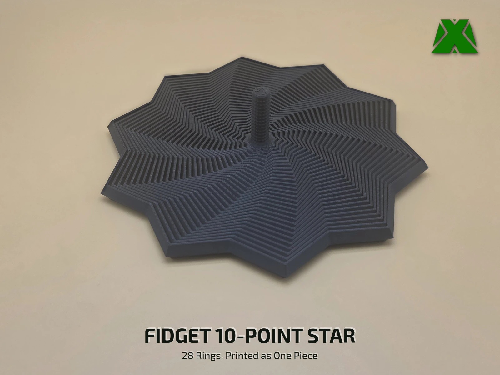 A black print-in-place fidget ten-point star twisted flat on a tan backdrop, its 28 rings swept around into a pinwheel with the points fanned out