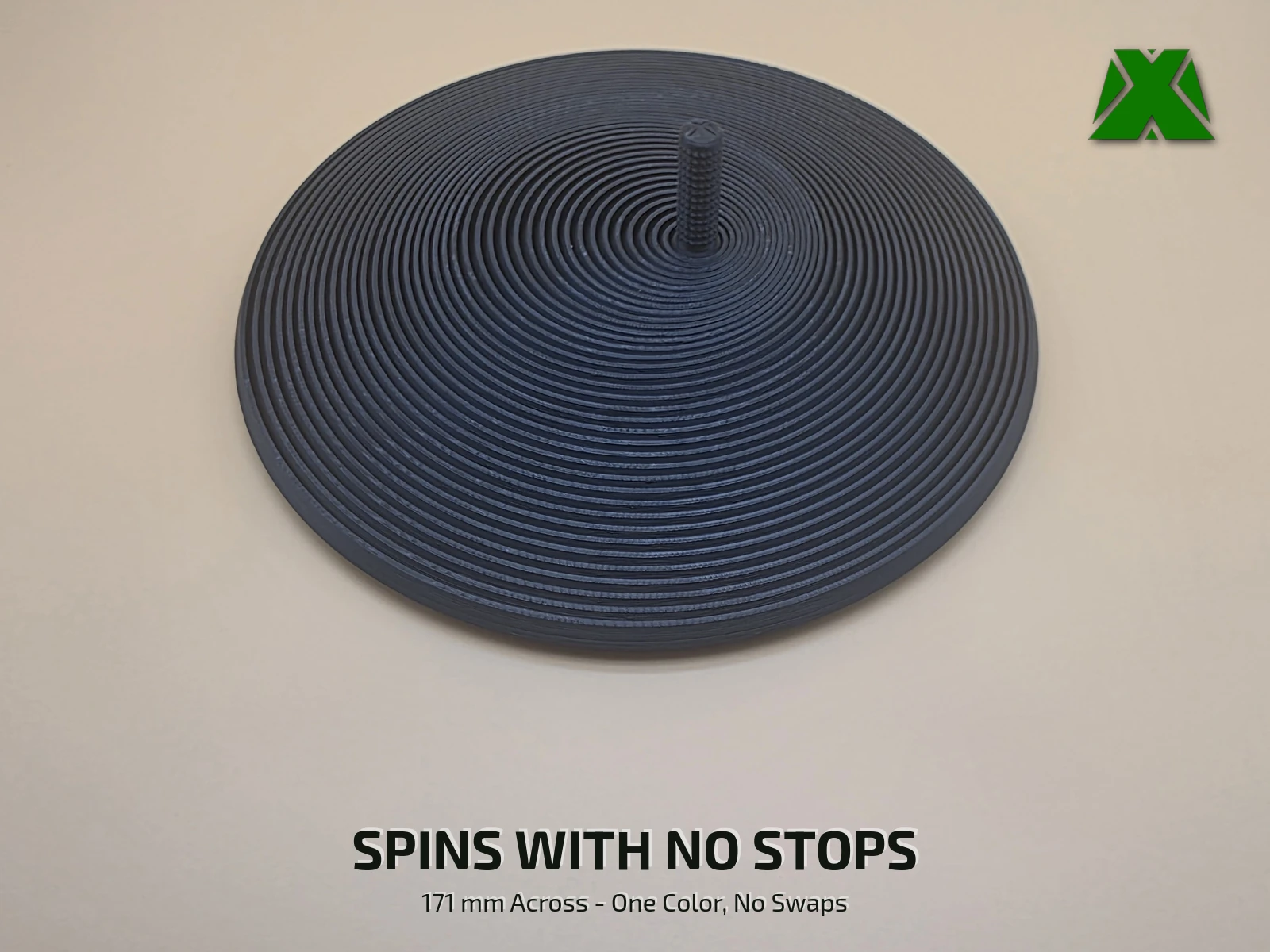 The fidget circle seen from a little higher, lying flat with all 38 rings level and the textured stem standing at the center