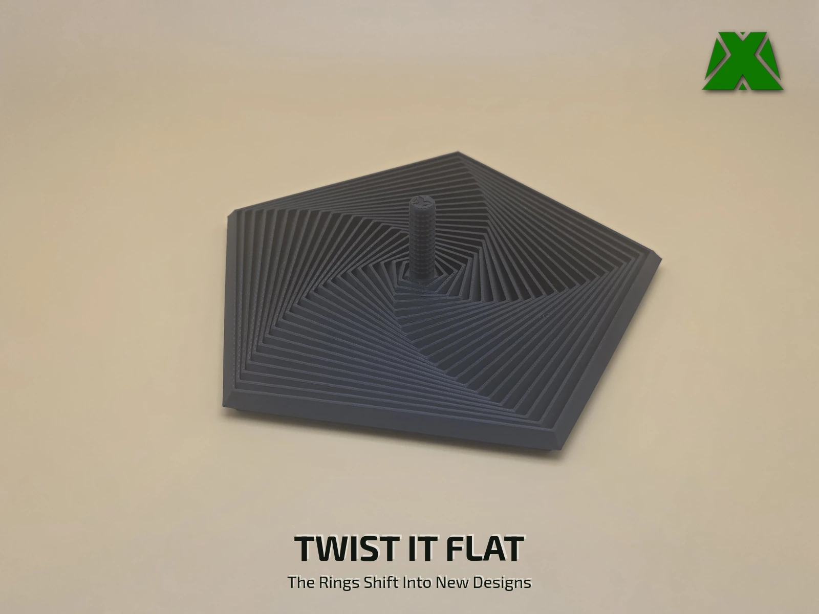 The fidget pentagon twisted flat on the desk, its 22 rings swept around out of line into a five-armed pinwheel