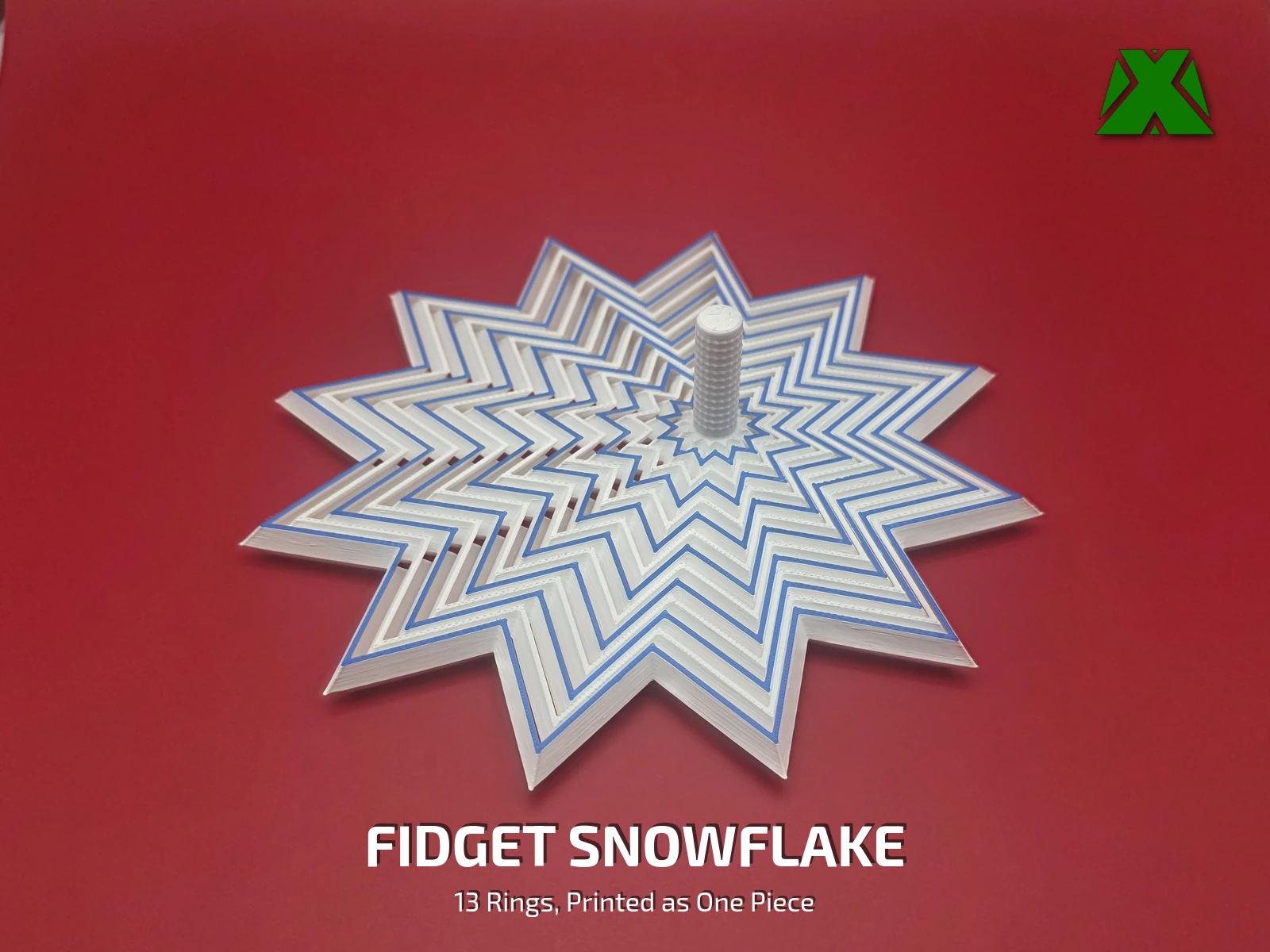 A white and blue fidget snowflake on a deep red backdrop, its twelve-point rings twisted out of line into a swirl, with a textured stem standing up at the center