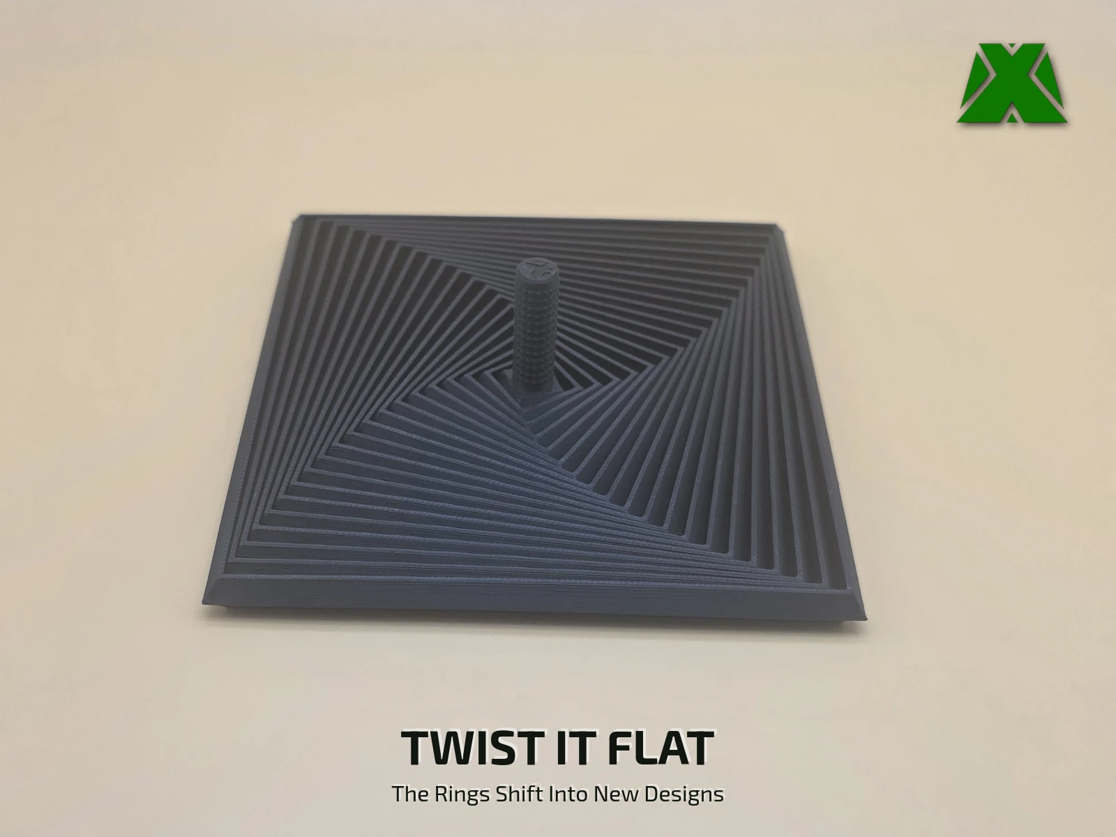 The fidget square twisted flat on the desk, its 19 rings swept around out of square into a pinwheel of straight black lines