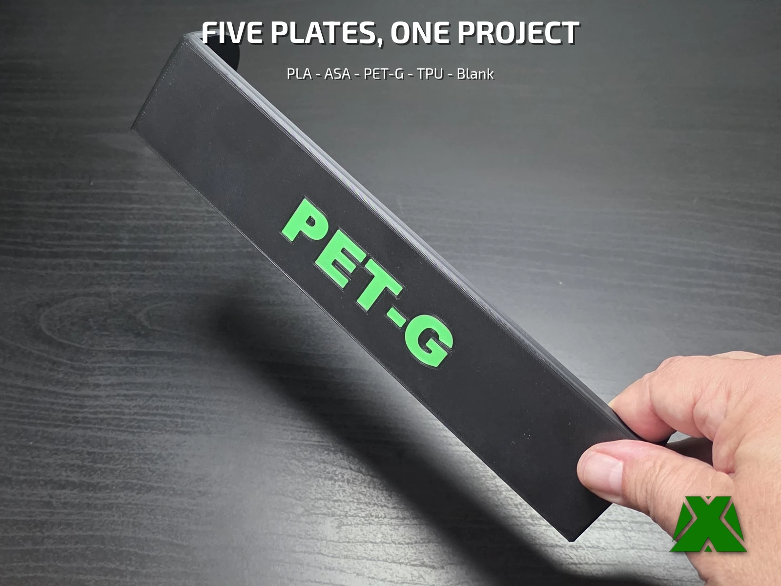 The same bar printed as the PET-G variant, black with green lettering