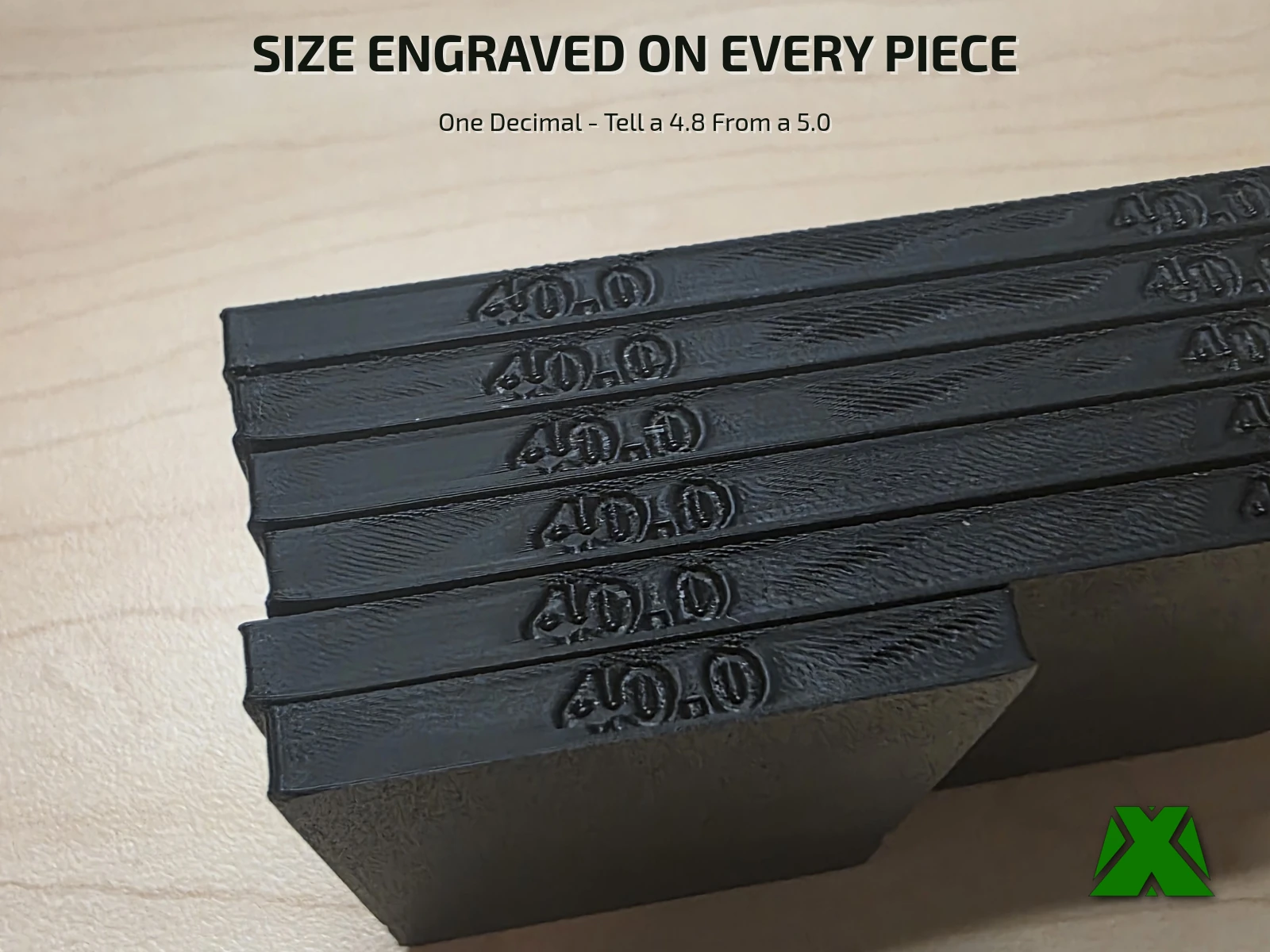 A stack of 40 mm spacers with 40.0 engraved on the edge of each piece