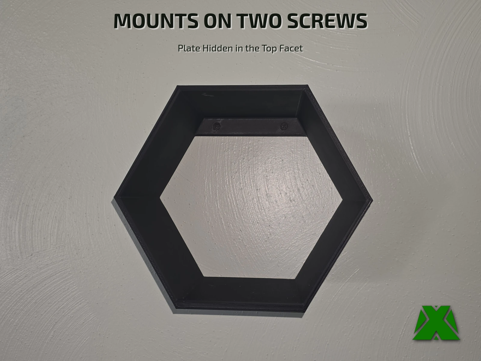 The empty shelf face on against a white wall, the mounting plate spanning the inside of the top facet with both screw heads sunk into it