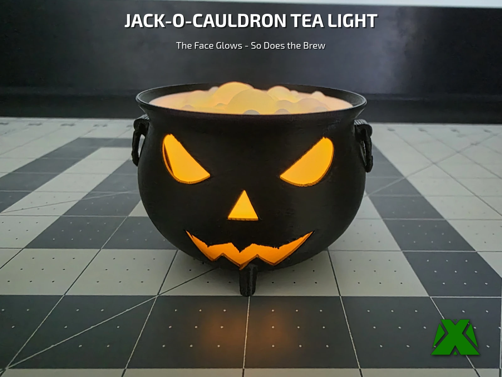 The finished cauldron lit from inside, its carved face glowing orange and the bubbling brew glowing above it