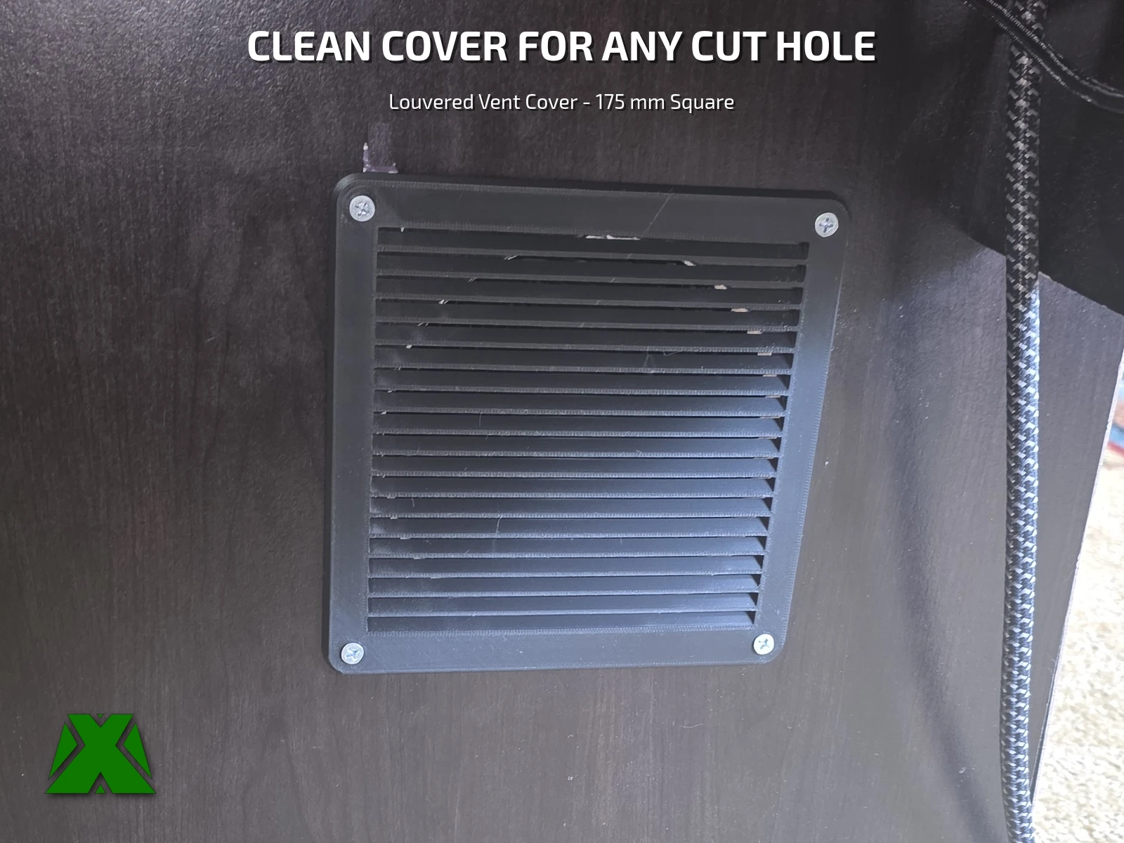 The black louvered panel screwed over a cut opening in a dark wood cabinet panel, its angled slats running edge to edge