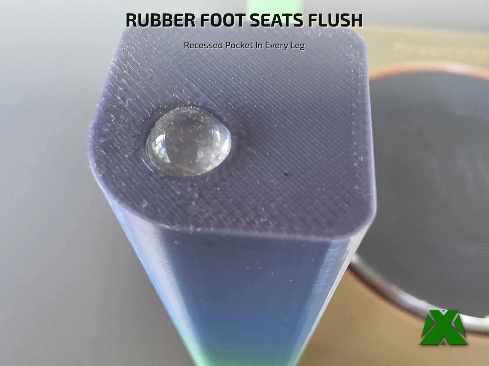 Close view of one leg end, with a clear rubber bumper sitting flush in a recessed pocket