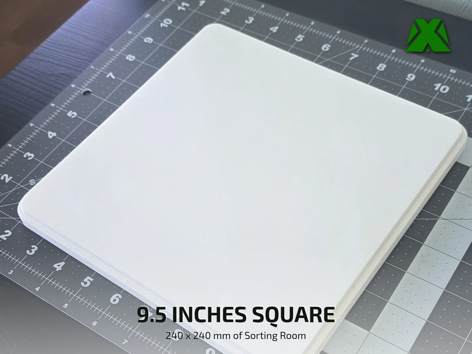 A tray laid on a cutting mat, measuring 9.5 inches across