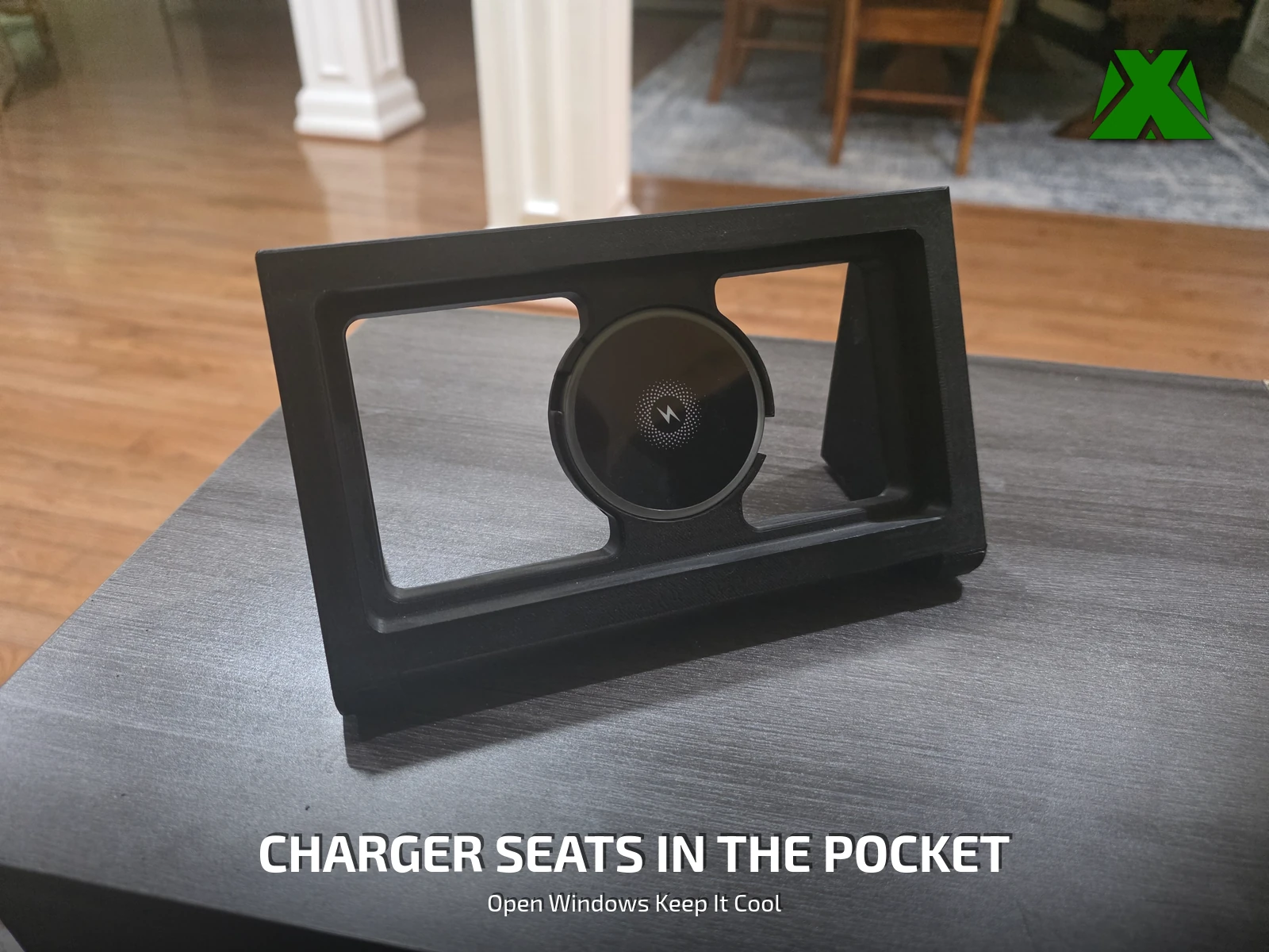 The empty stand on a table, a round magnetic charger seated in the phone pocket between two open windows