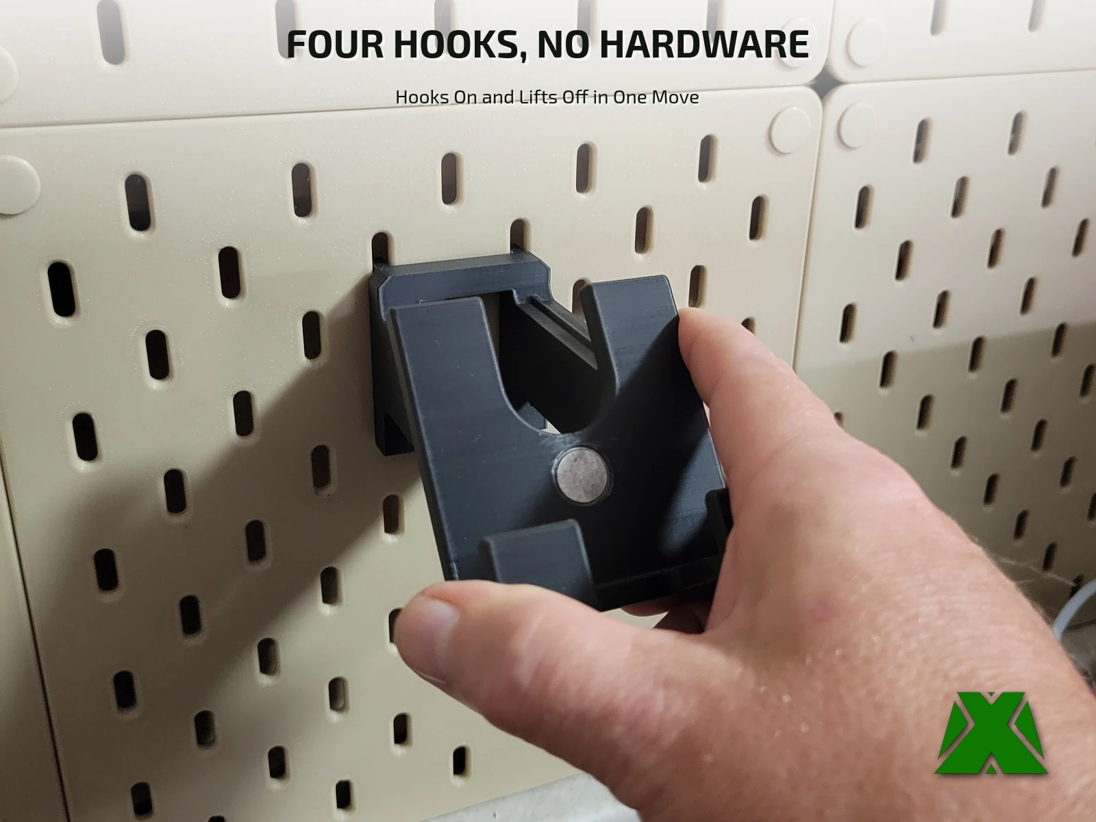 The mount being lifted off the pegboard in one movement, no hardware holding it
