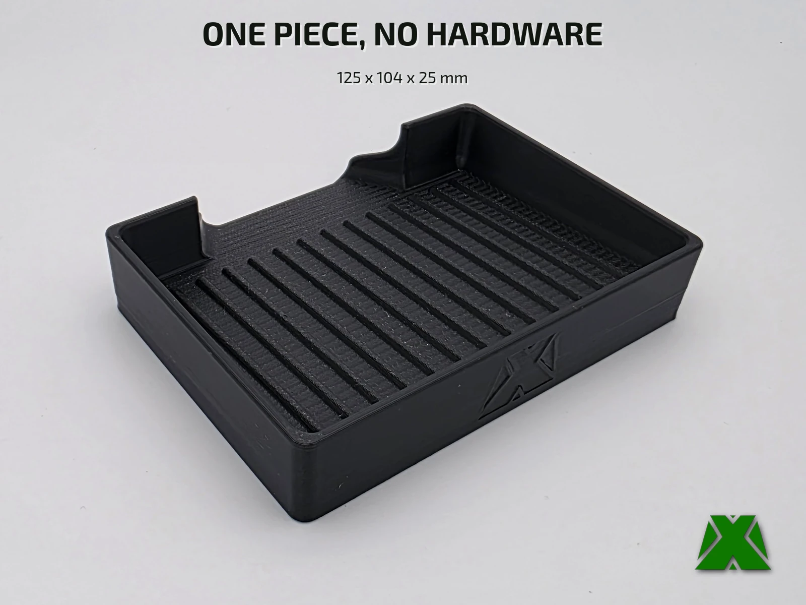 The empty black tray seen from behind, showing the back wall and the ribbed floor