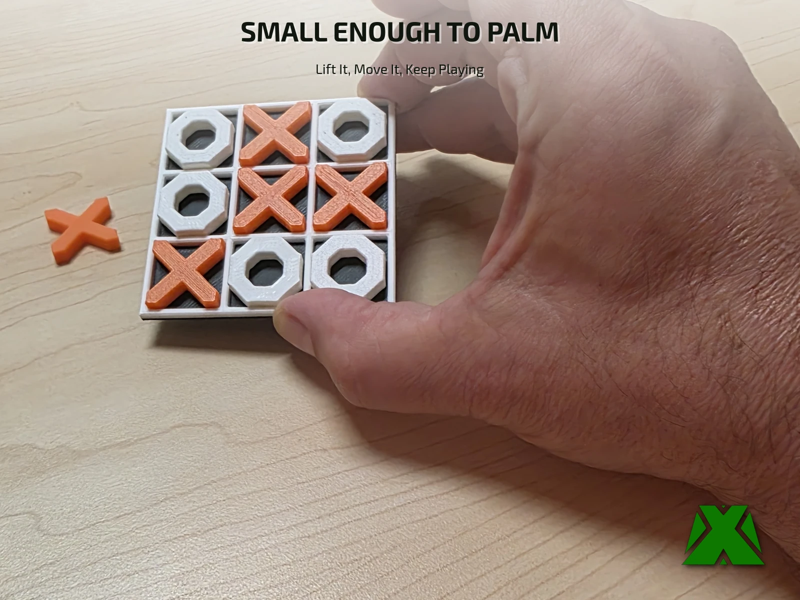 The board held in one hand, showing how small the set is