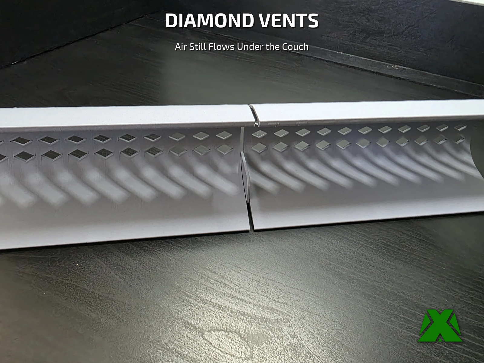 Close view of two joined toy blocker sections showing the rows of diamond-shaped vents
